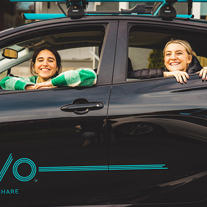 Two friends looking out Evo car windows