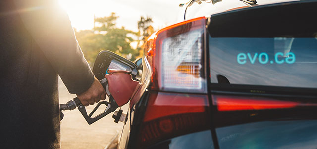 Person refueling an Evo at gas pump